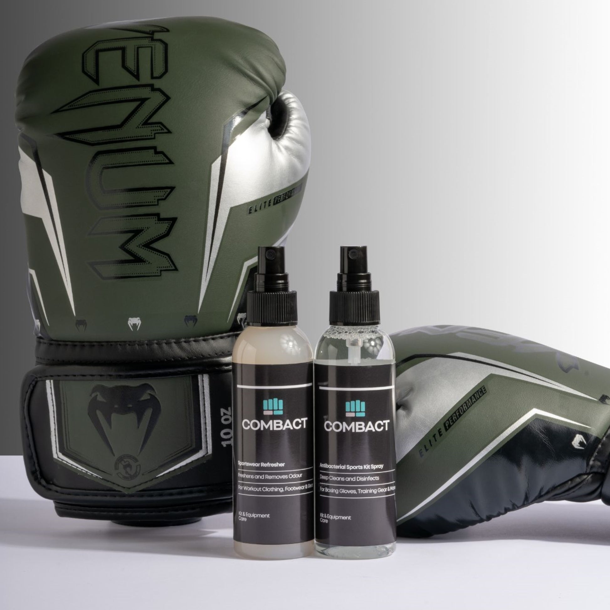 Photograph of a pair of boxing gloves next to Combact Sportswear Refresher and Antibacterial Sports Kit Spray.