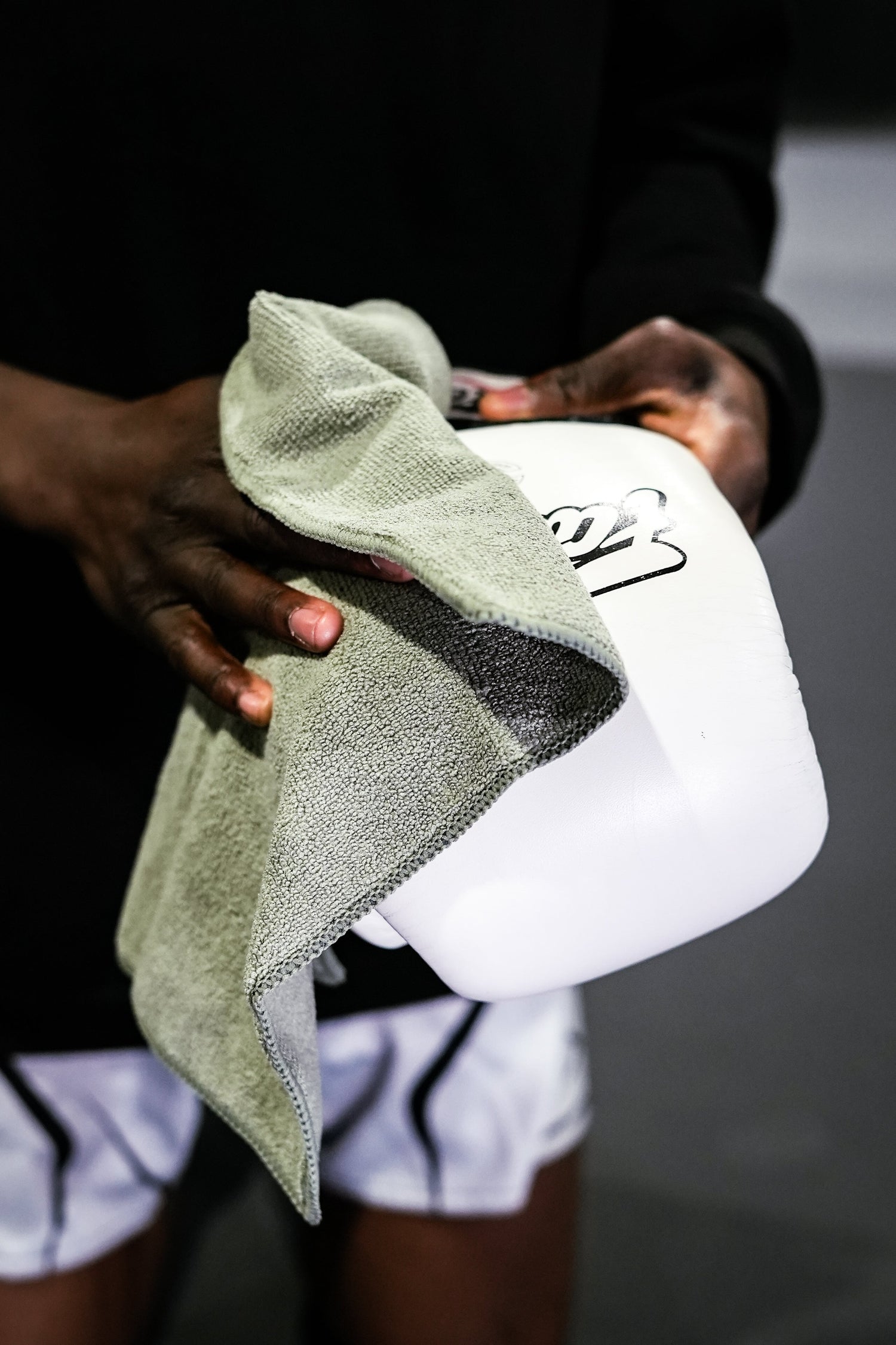 Boxer in his full boxing kit and gloves in his stance, in the Boxing ring, after using the Boxing Gloves Deodorizer and Boxing Gloves Cleaner Spray